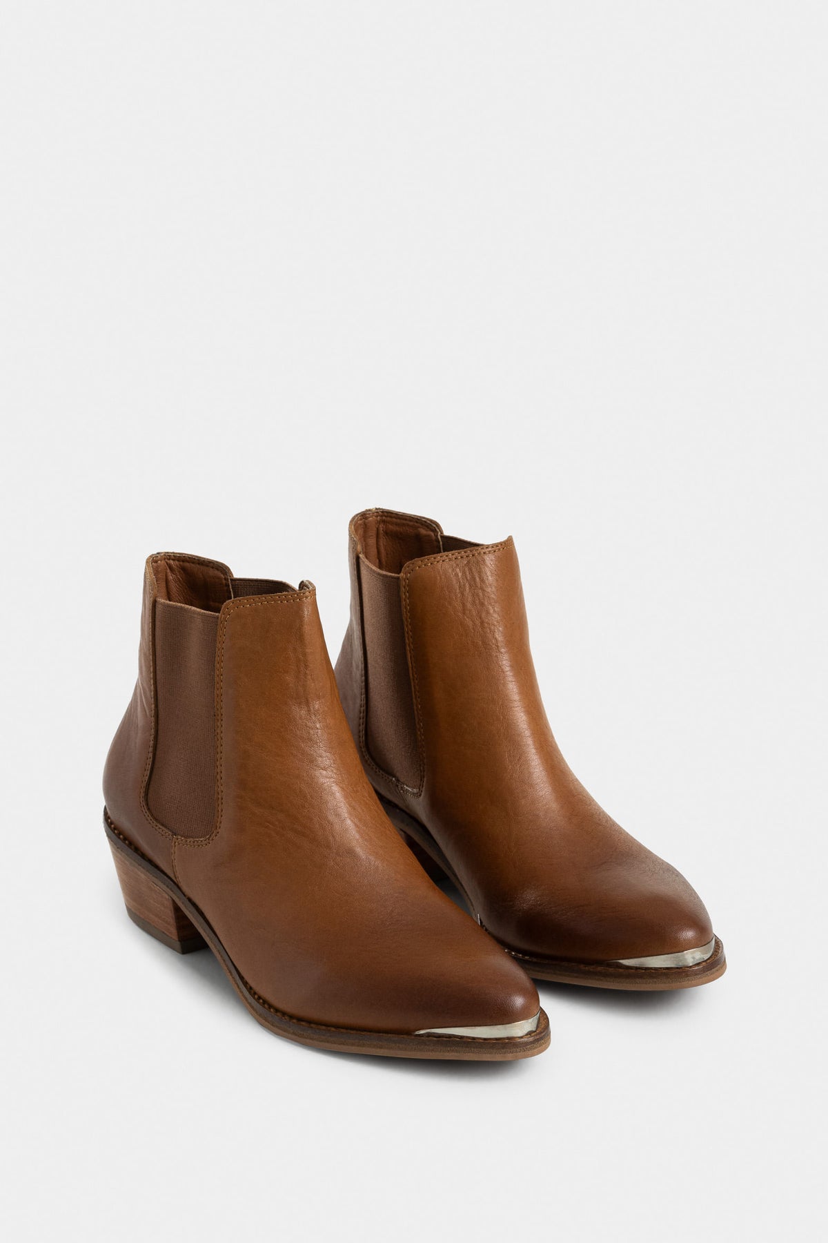 Dark leather ankle boots with metal toe cap for women
